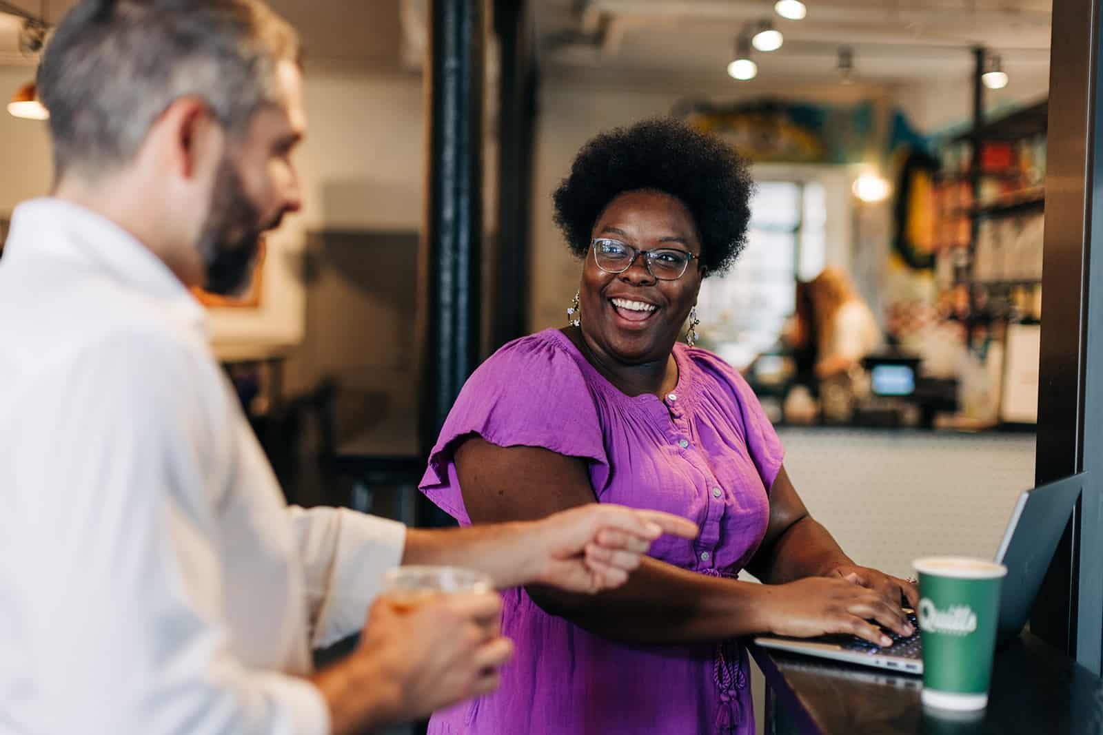 Man and Woman Joyfully Discuss Business