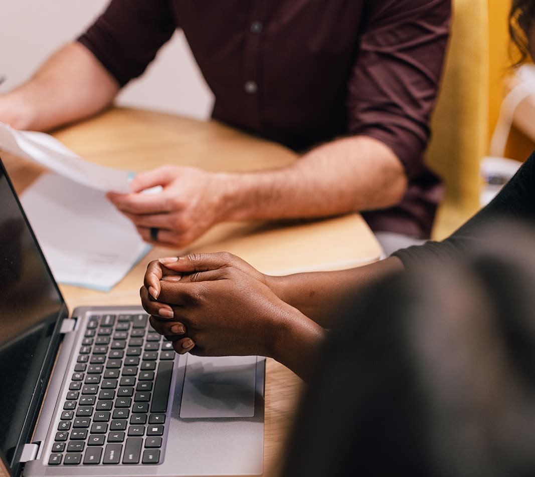 Coworkers review documents in a meeting