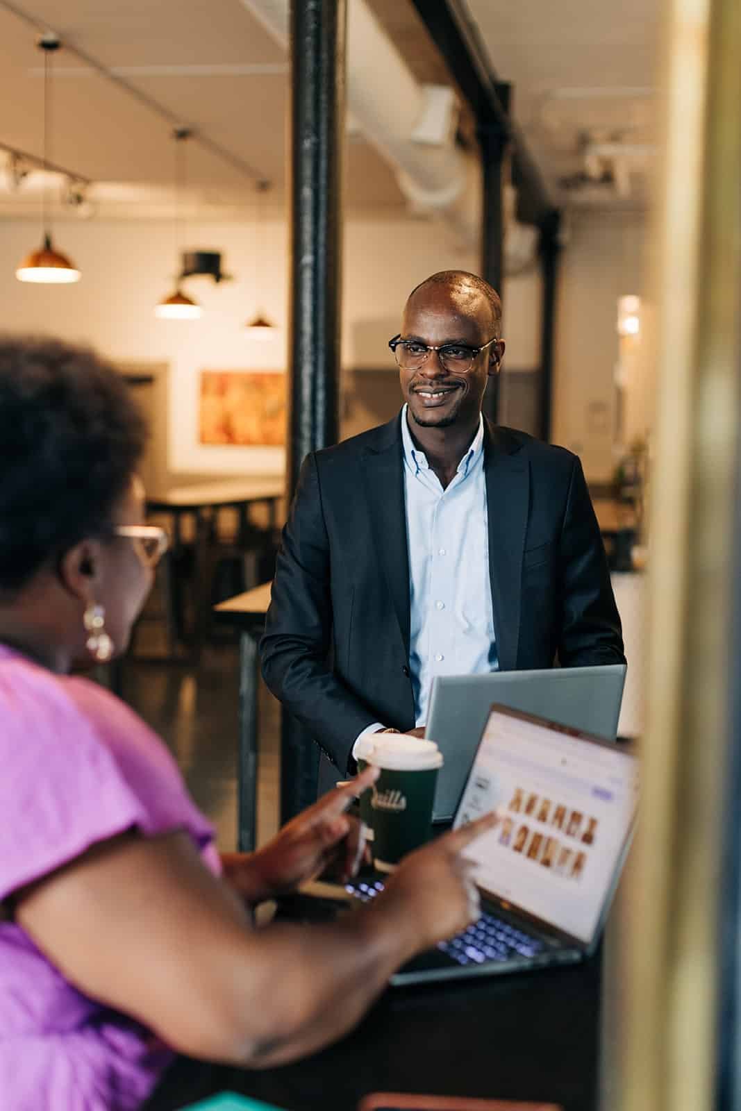 Business discussion in modern workspace.