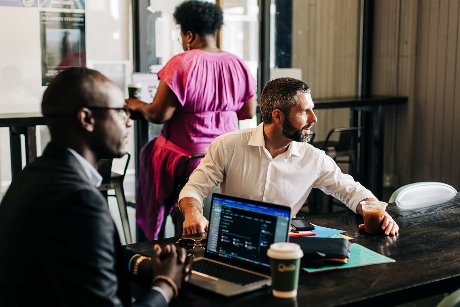 Business meeting in a café setting.